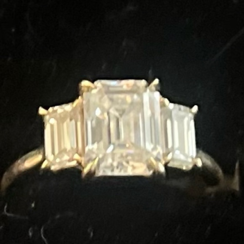 3 stone Emerald cut Moissanite ring. 14k yellow gold. Size 4.